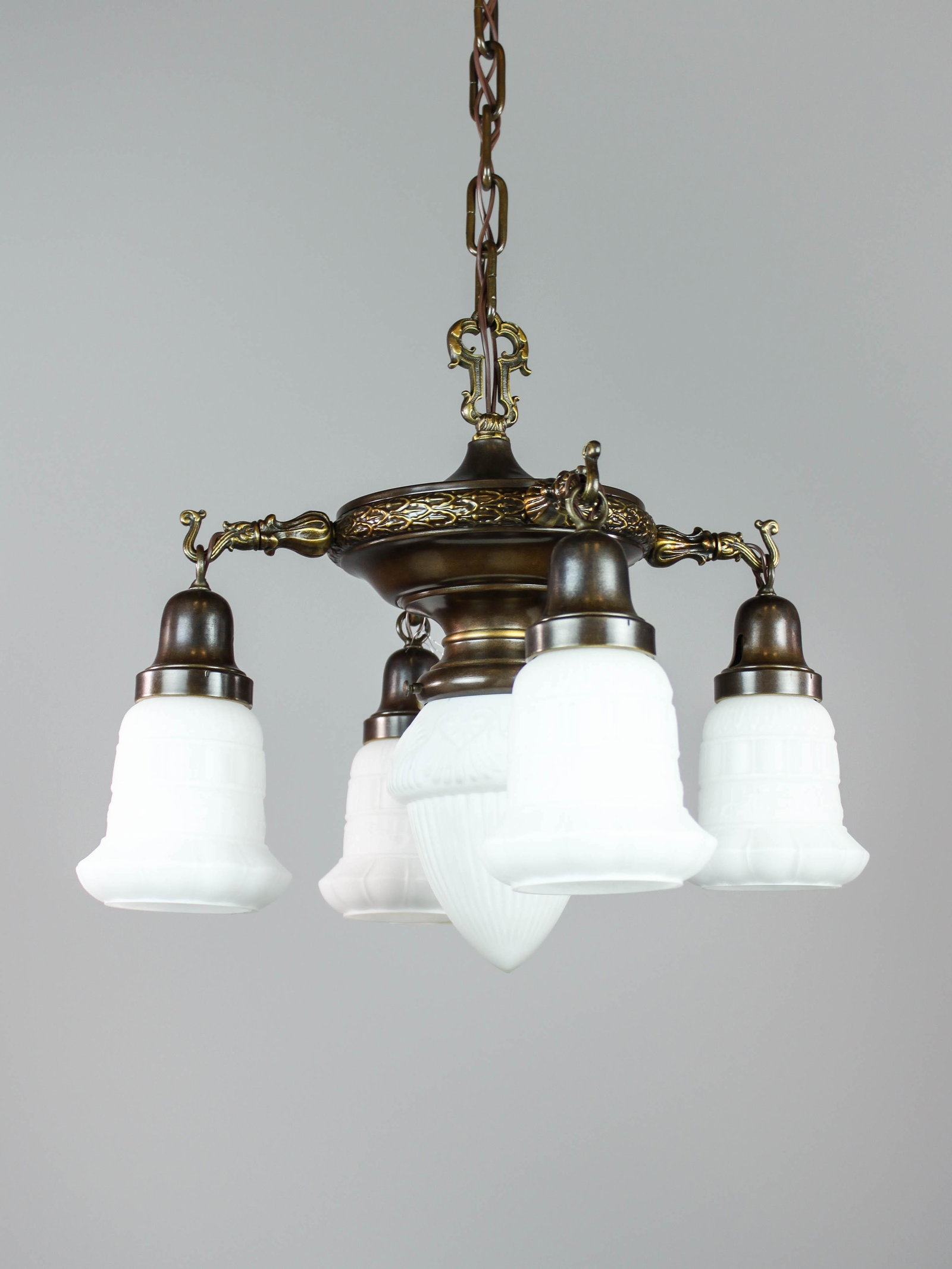 Colonial Revival Pan Light with Center Shade (5Light): Ca. 1915 Colonial Revival pan light fixture with antique milk glass. Decorated with a foliate rim and Sheffieldstyle hooked arms in a deep bronze finish. Rewired and ready to hang. 16"H x 19"W x 38"L