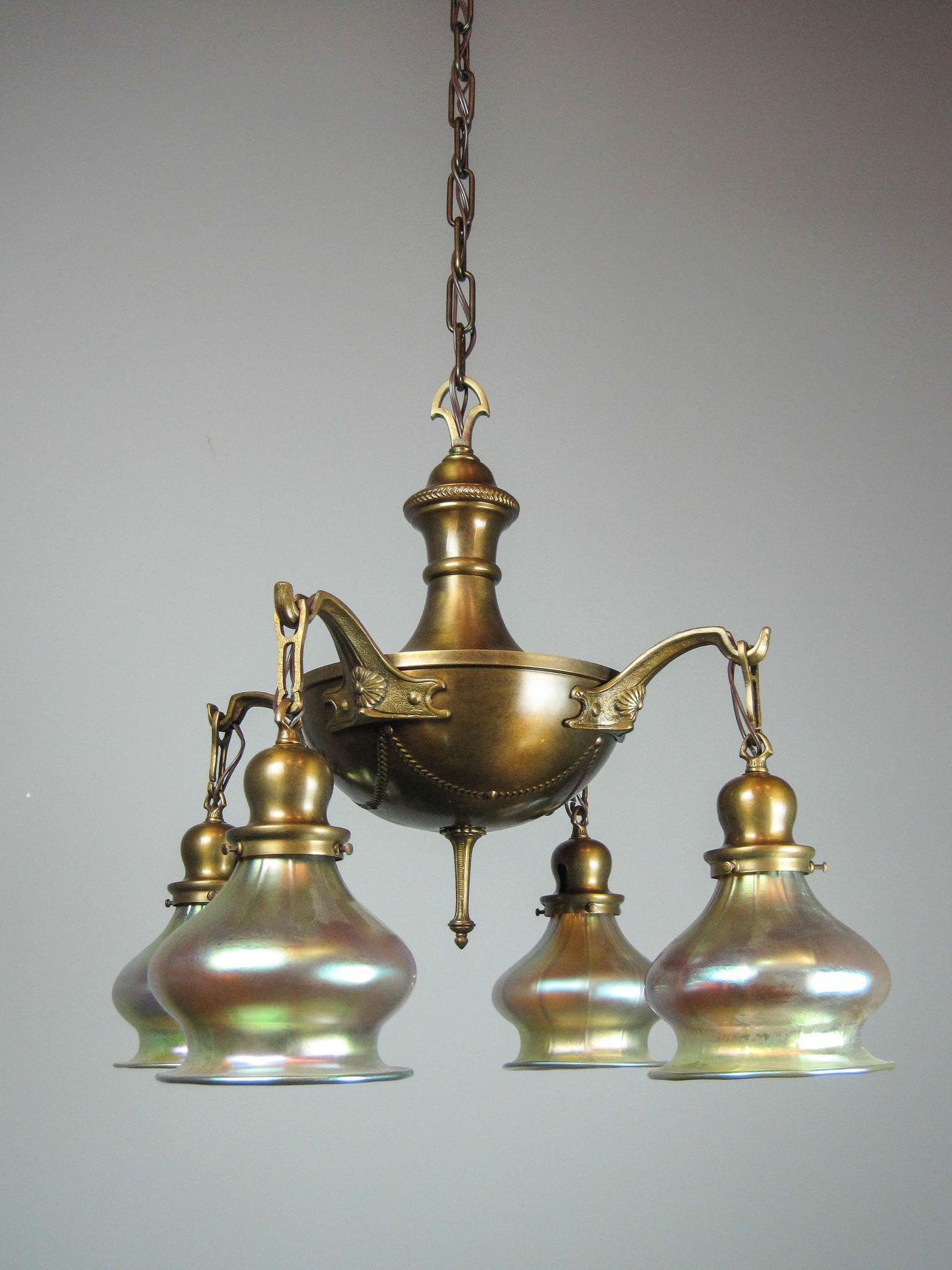 Edwardian Pan Light Fixture with Art Glass Shades: Ca. 1911 A cast and embossed brass pan fixture in the Edwardian/Colonial style. Matched garland and floral decoration on body and canopy, bells fitted with art glass shades. Beautiful original fixture