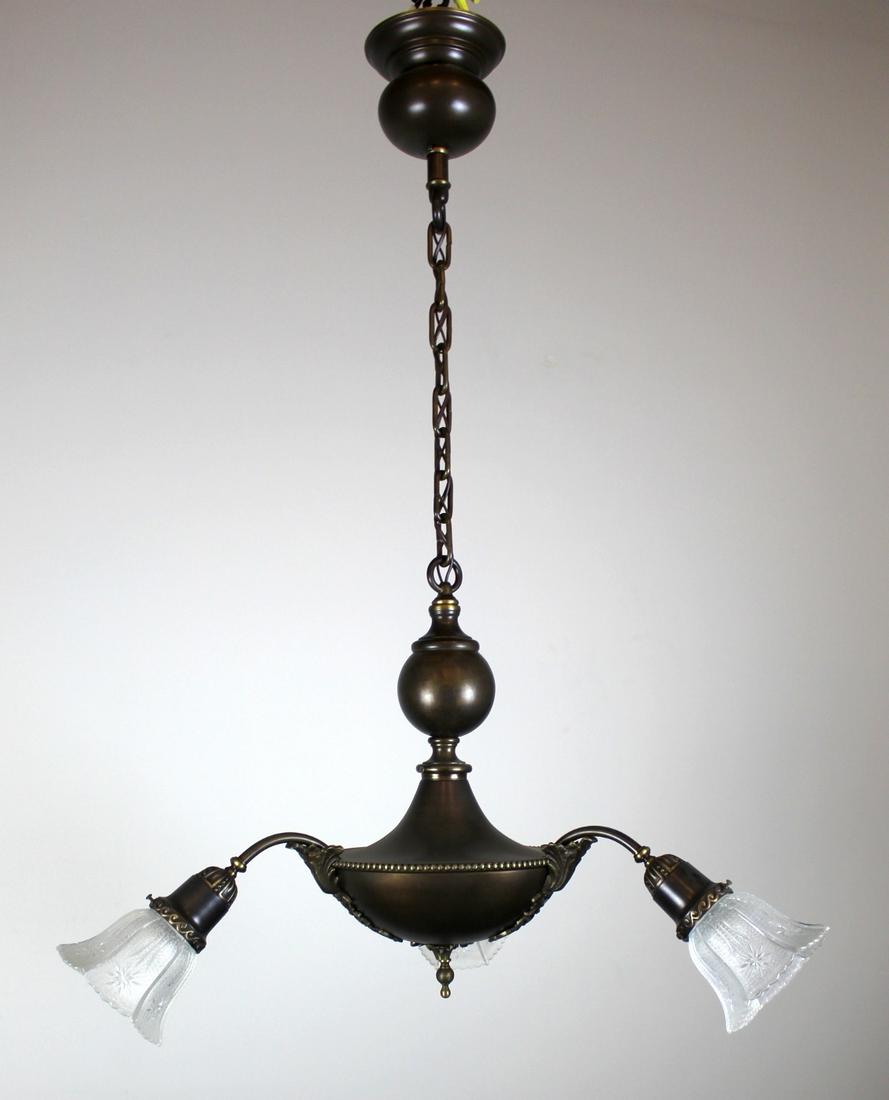Unusual Decorative Pan fixture: 3 Light Pan fixture, with interesting decorative elements. The 'ball' motif twinning canopy and body really tie the fixture together visually. 3 shallow angled arms ending in clear embossed shades. Fi