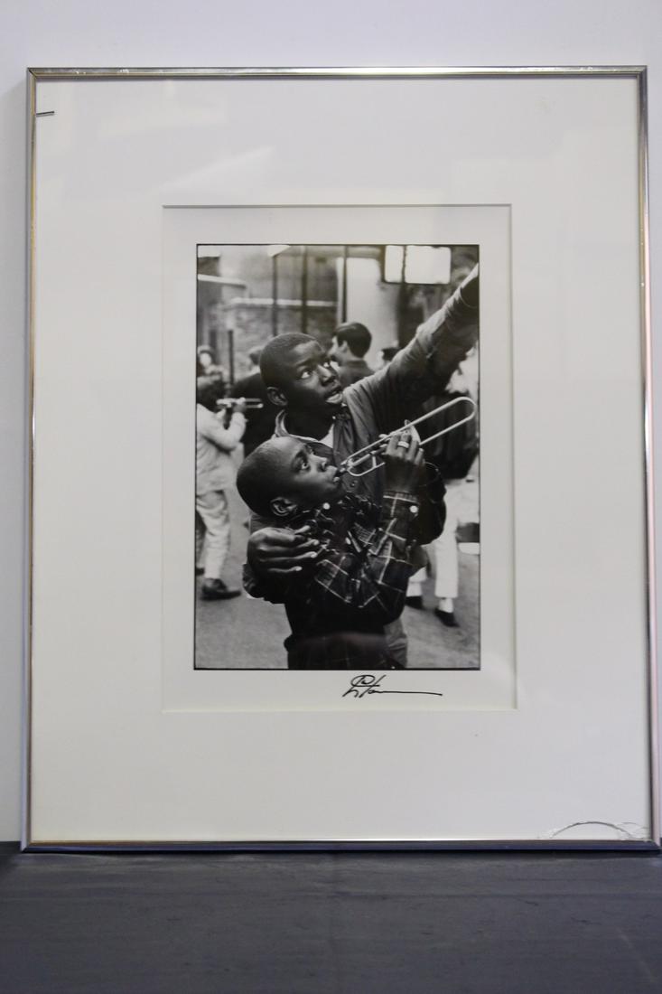 Leo Touchet 1989 BW Signed Photo of 2 Boys: Leo Touchet 1989 BW Signed Photo of 2 Boys, one playing the trumpet. Taken on Bourbon street New Orleans. Measures 16.25"W x 20.25"H x 1"Depth (including frame).