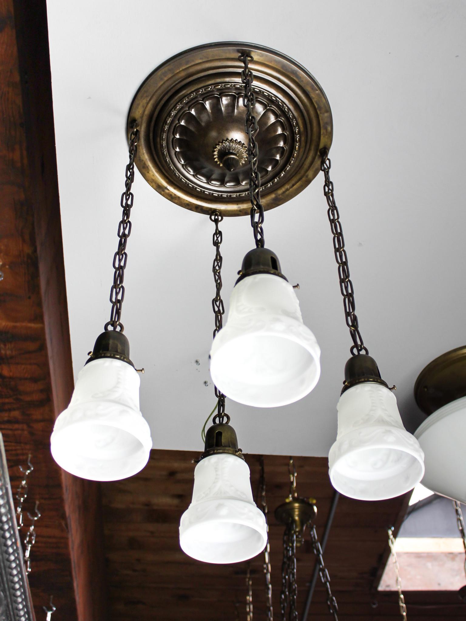 Embossed Flush Mount Light Fixture (4Light): Ca. 1913 Embossed 4light flush mount fixture with antique finish, all original and fitted with periodcorrect milk glass shades. Length of fixture can be adjusted at your request. Fully restored and re