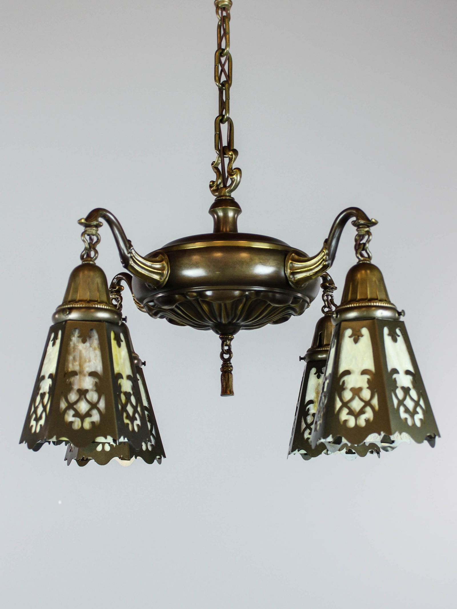 Antique Sheffield CutOut Light Fixture (4 Light): Ca. 1910 Antique pan light fixture with Sheffield patterned body and shade holders. Cast, scrolling arms hold original cutout shades fitted with caramel slag glass. Beautiful condition, restored and r