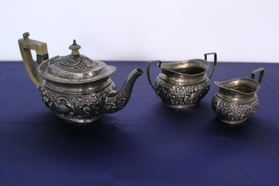 C. 1900 3 pc. Sterling Silver Rococo Tea Service: C. 1900 3 pc. English Sterling Silver Rococo Tea Service. Largest piece is 9"L x 4"W x 5"H. Total weight 1 lb.