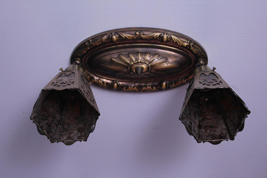 C. 1910 2 Light Flushmount Embossed Body: C. 1910 2 Light Flushmount with Embossed Body and cut out shades. Measures 12"L x 6"W x 10" H (drop) x 3"H (body), 4 lbs.