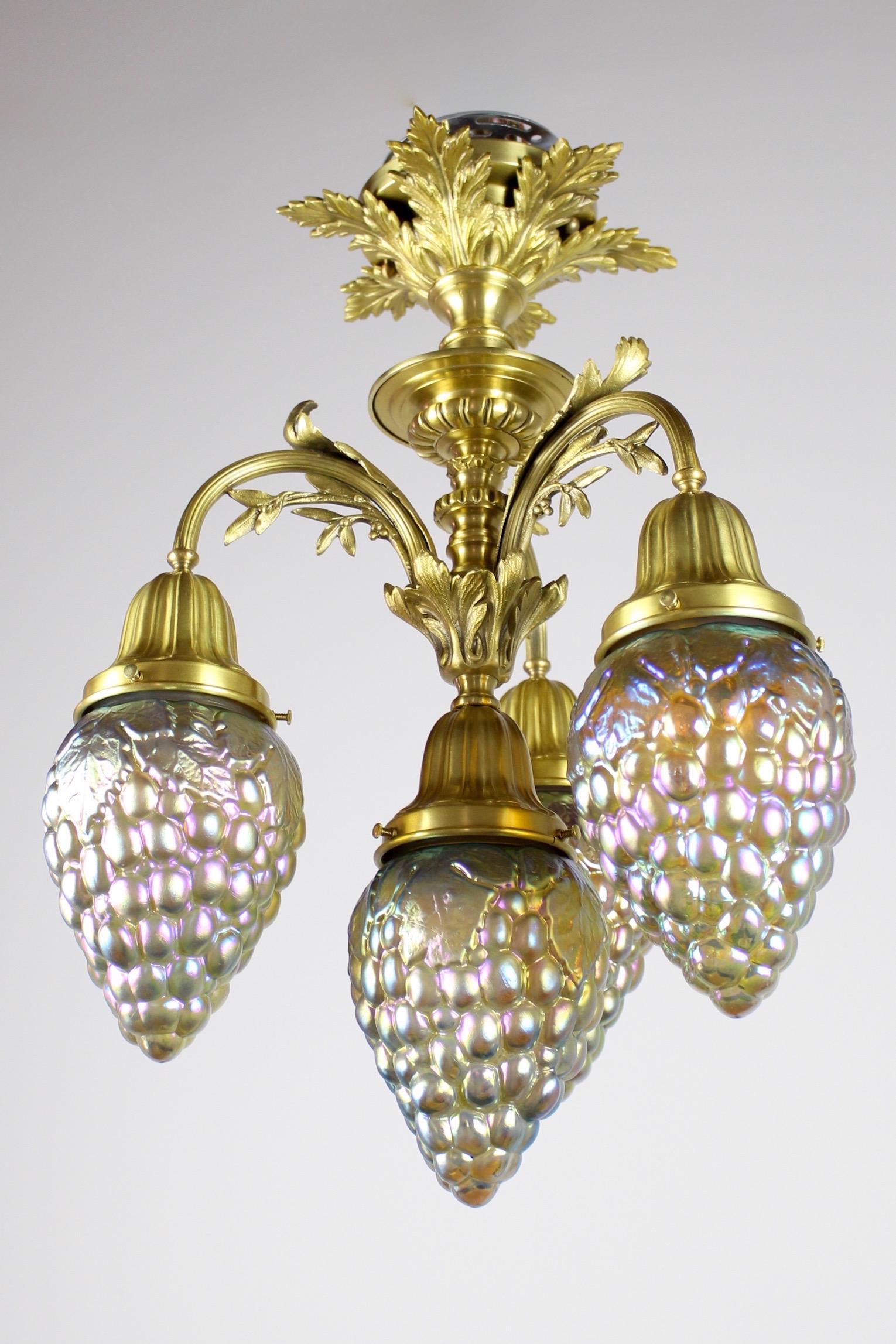 C. 1905 Rococo Revival Flushmount with Art Glass Shades: Circa. 1905 This is a sweet and petite decorative flushmount in the style of Rococo Revival. This brass light fixture uses a foliate motif of four "grape vine" arms, each holder is fitted with an art 
