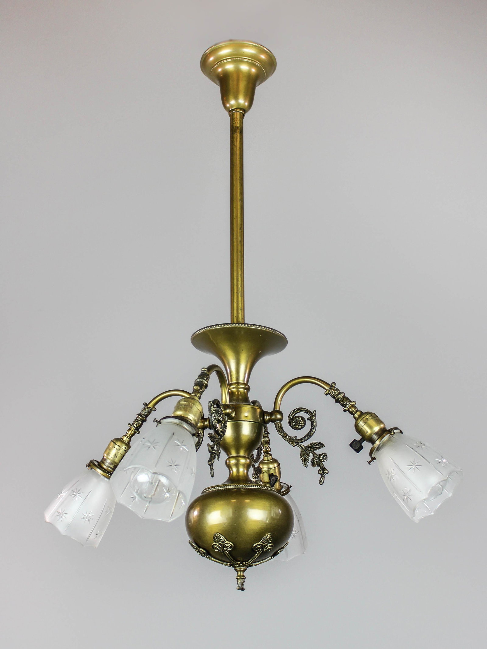 R. Williams and Co. Colonial Light Fixture (4 light): Ca. 1910 A Colonial Revival style light fixture by R. WIlliams and Co. of Chicago, Illinois. Decorated, scrolling arms with original shades and antique finish. Rewired and ready to mount. 35"L x 25"W