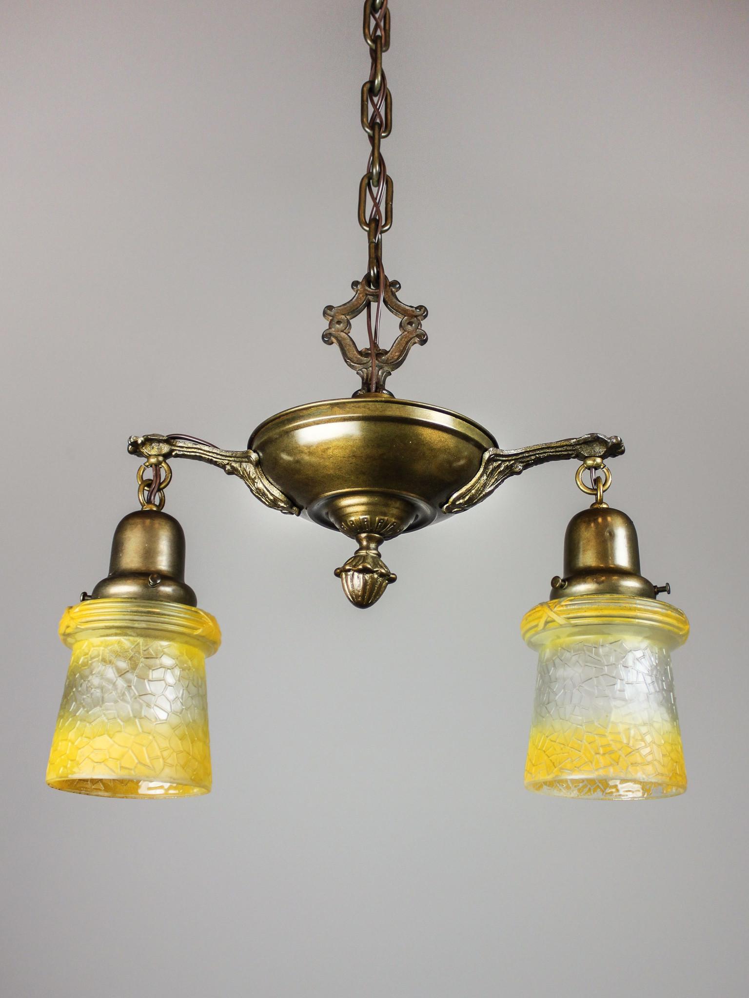 Antique Pan Fixture with Original Shades (2 Light): Ca. 1914 Original pan light fixture with detailed embossing and cast arms fitted with antique yellow shades. Period finish on both the fixture itself and shades, some variation to be expected. Re wire