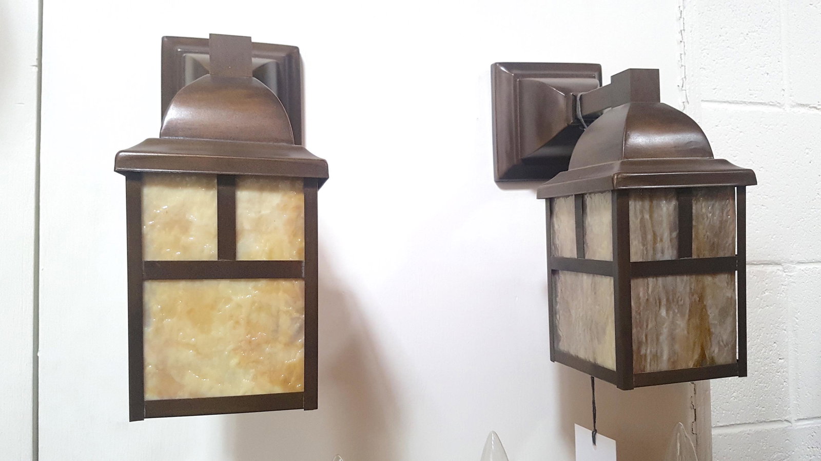 Pair Arts and Crafts Mission "Naramata" Lantern Wall: Pair of Arts and Crafts "Naramata" lantern sconce. A classic light featuring caramel slag glass and available in olive bronze or black (painted) finish. 8"L x 8"D x 4"W