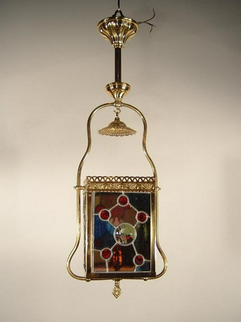 Aesthetic Era Gas Hall Light Fixture: Ca. 1885 Lantern fixture fitted with jewels and colored beveled glass. Refinished in a gold finish. 30"H x 10"W