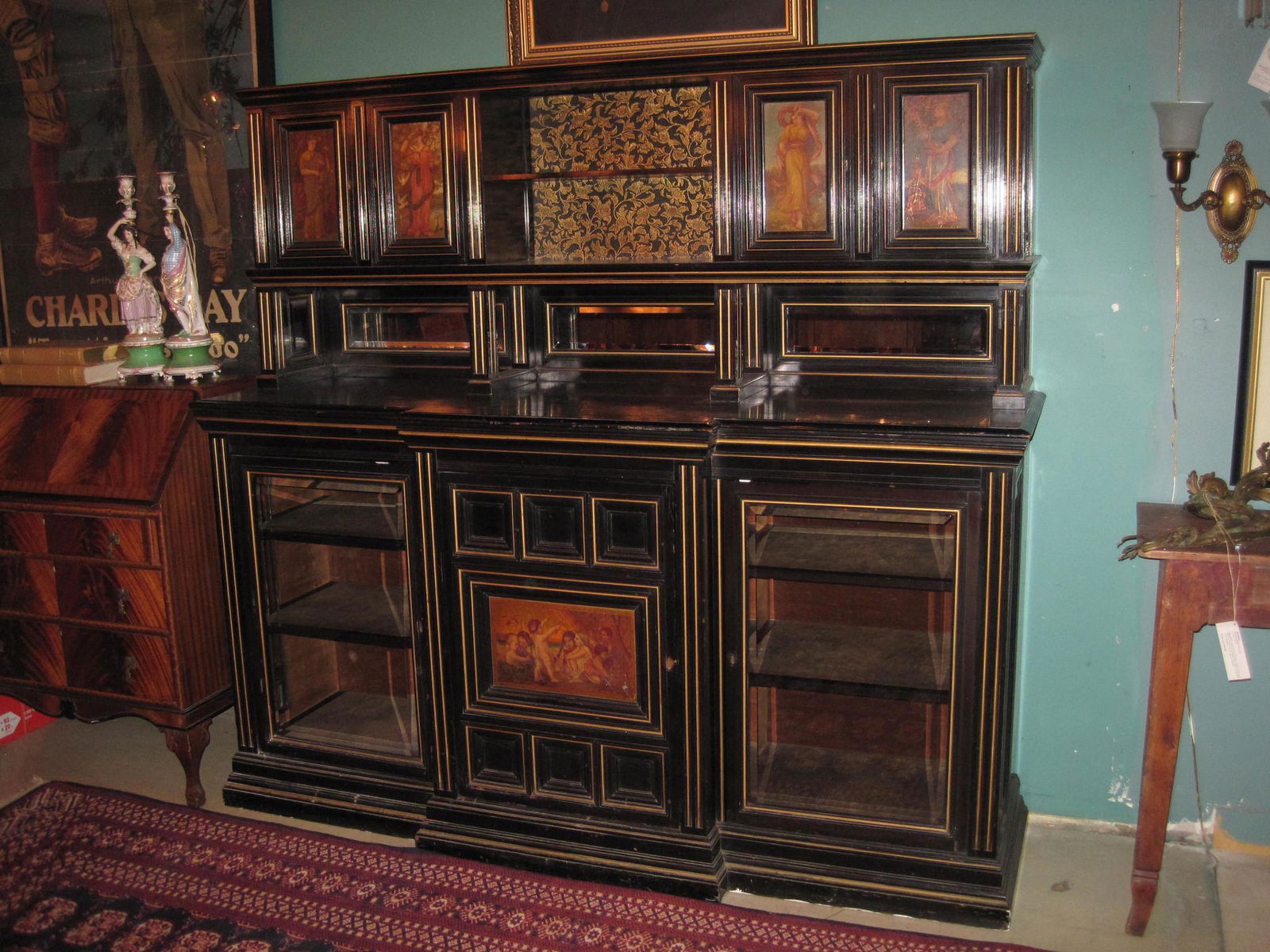 Ebonized Mahogany English Sideboard: Ca. 1875 English sideboard from the 'William Morris School'. Ebonized mahogany with gold incised carving and hand painted scenes. 76"L x 70"W x 22"D