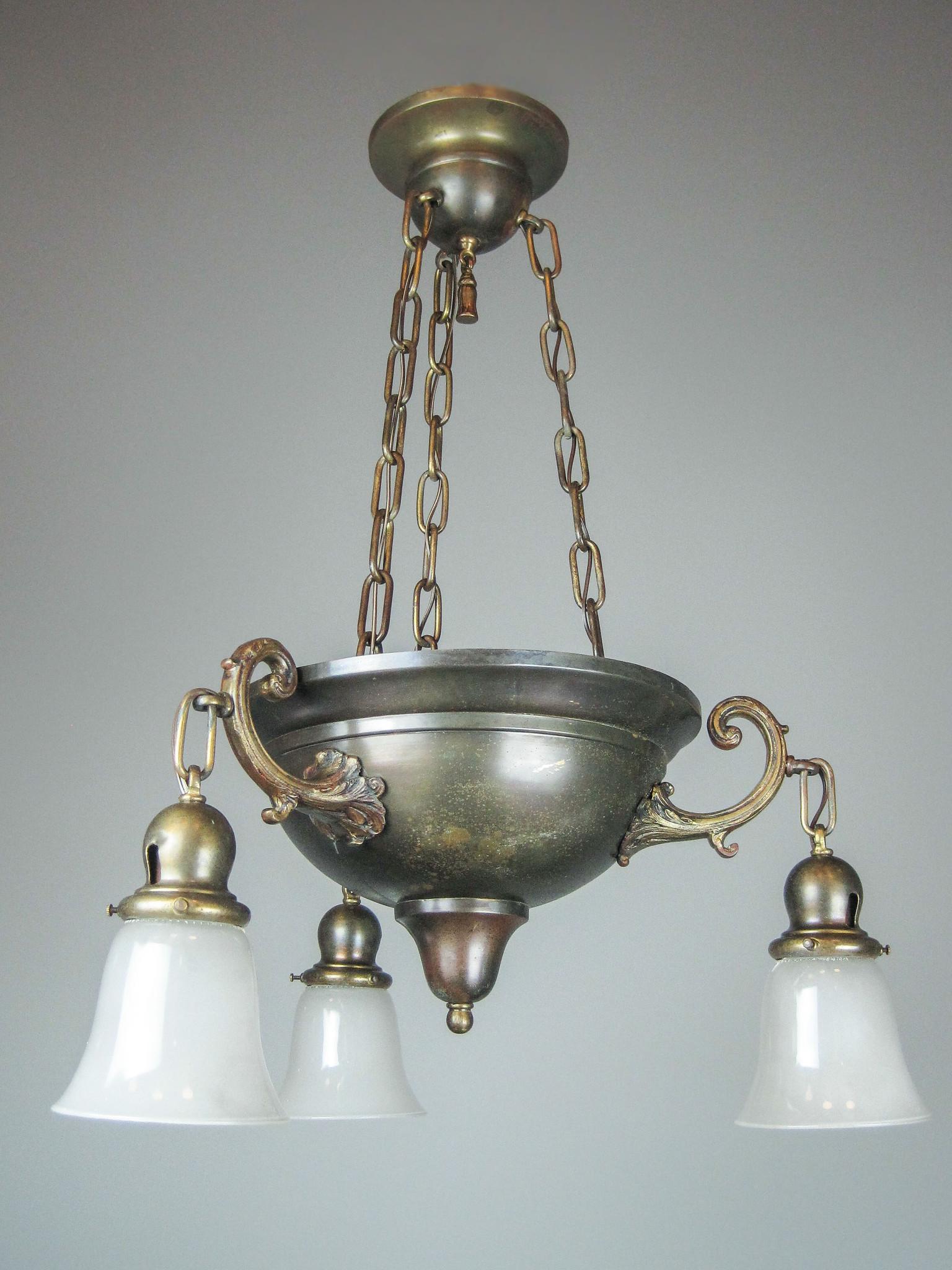 Original Arts and Crafts Bowl Light Fixture: Ca. 1910 Arts and Crafts bowl fixture with original preserved finish. Cast arms are heavily detailed, central bowl is suspended from matching canopy by three chains. Fitted with three bell shades. Ful