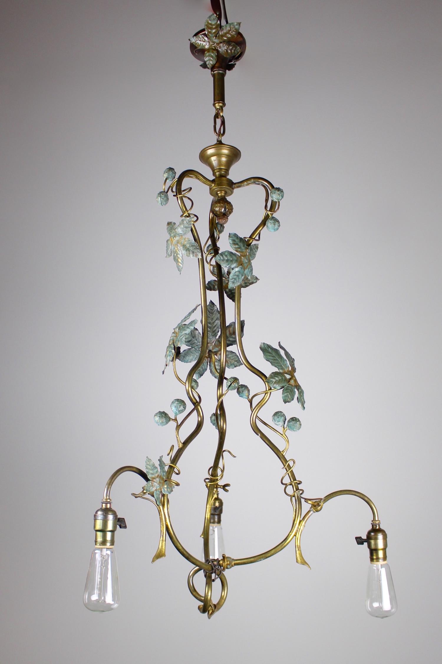 Organic Three Light Gas Fixture, Circa 1910: This is a converted gas to electric fixture, circa 1910. Constructed in an extremely organic manner, the light has the appearance of having just grown out of the ceiling. The light is fitted with thre