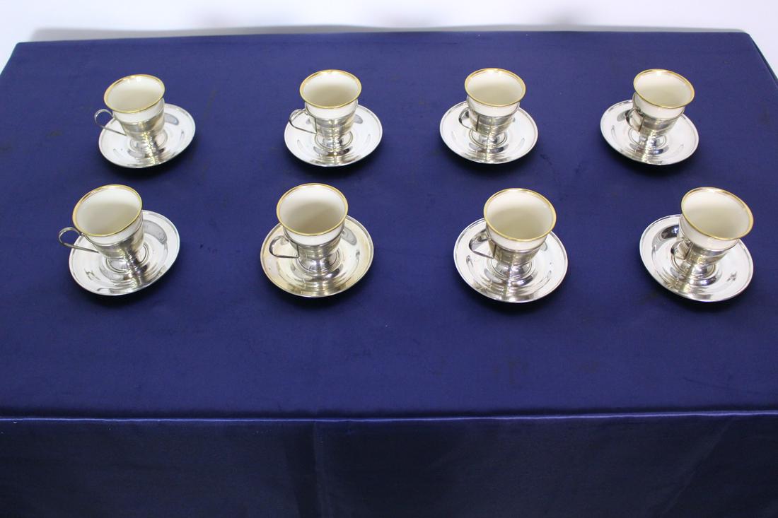 C. 1850 Set of 8 Silver and Lenox Ceramic DemiTasse Set: C. 1850 Set of 8 Sterling Silver and Lenox Ceramic DemiTasse Cups and Saucers. Saucer: 4"D x 0.5"H. Cup (silver and ceramic) 3"W x 2.5"H. Total weight: 1.5 lbs.