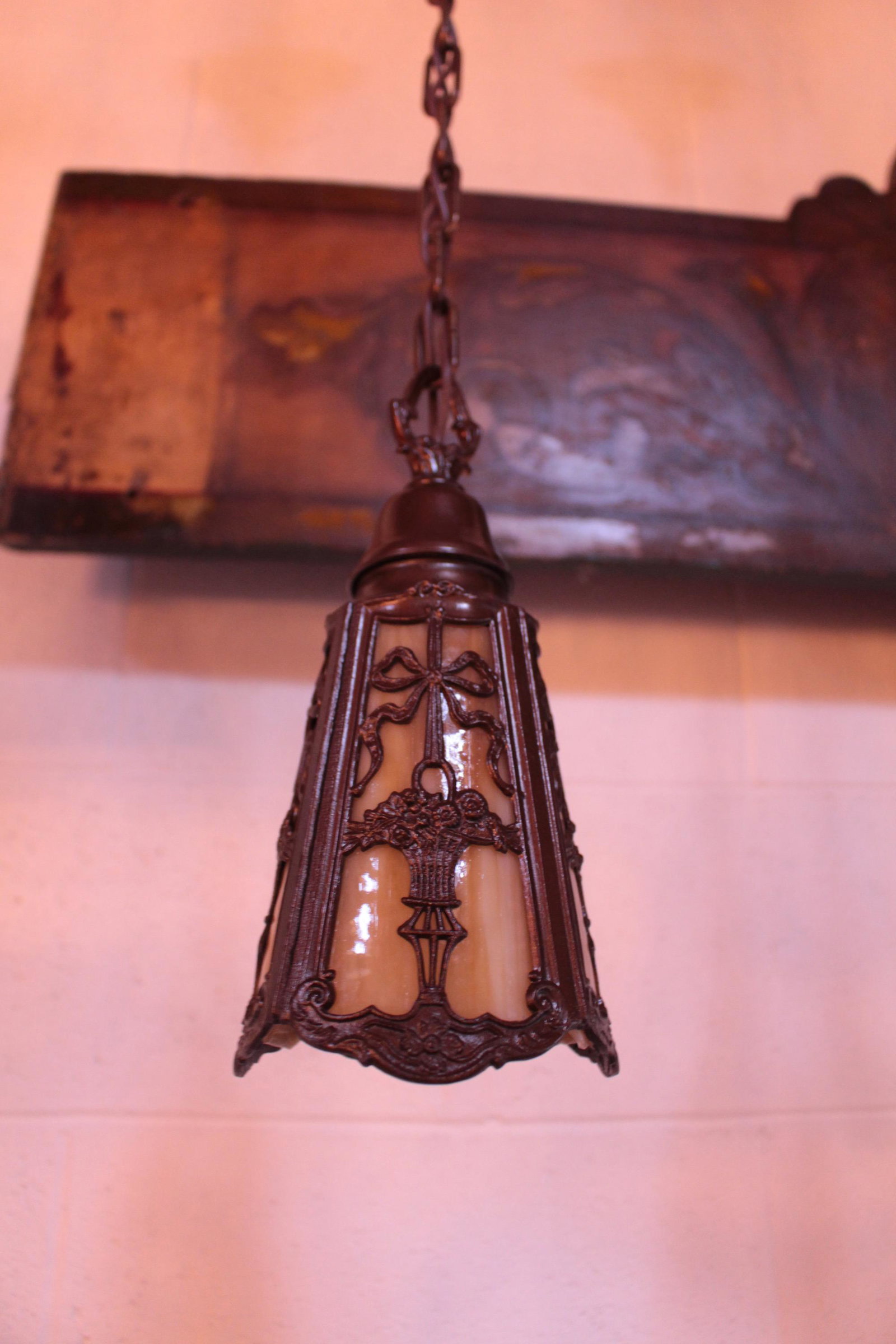 Antique Arts and Crafts Pendant Fixture: Antique Arts and Crafts Pendant Fixture with Highly Decorative Cutout Caramel Slag Glass Shades. Circa 1910. Measures 34"L x 5.5"D.