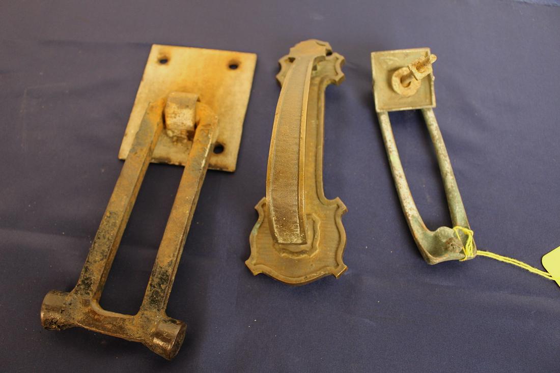 3 Vintage Door Knockers: Ca.1920 Georgian style door knocker, made of cast bronze, 2 1/4" x 8". Ca.1940 Georgian style chrome door knocker, 1 3/4" x 6 3/4". Ca1940 Homemade iron door knocker, 3.5" x 8".