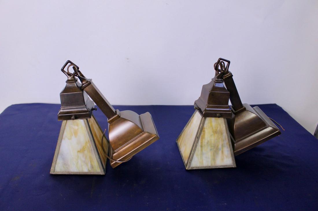 Pair of Arts and Crafts Mission Wall Sconces with: Pair of arts and crafts mission wall sconces with chocolate bronze finish. Marble art glass shades are included. Measures 8" depth