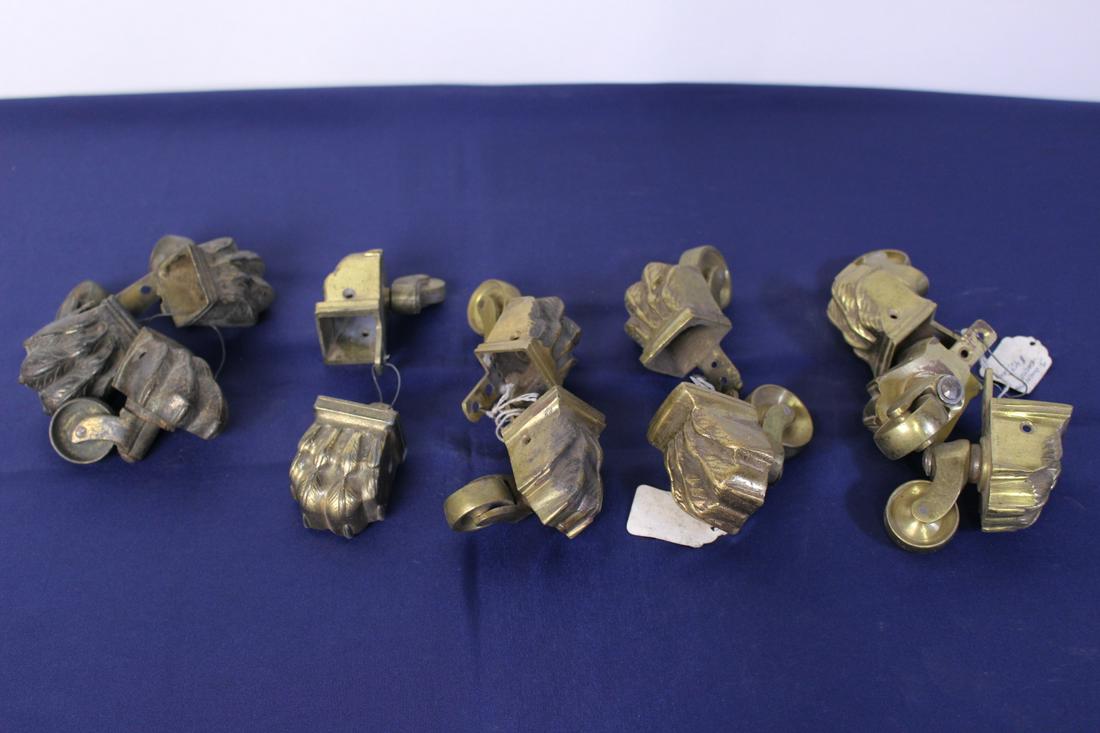 Set of 10 19th Century Cast Brass Casters: Set of 10 19th Century Cast Brass Casters with feather patterns, each measures approximately 3"25 L x 1.5"H