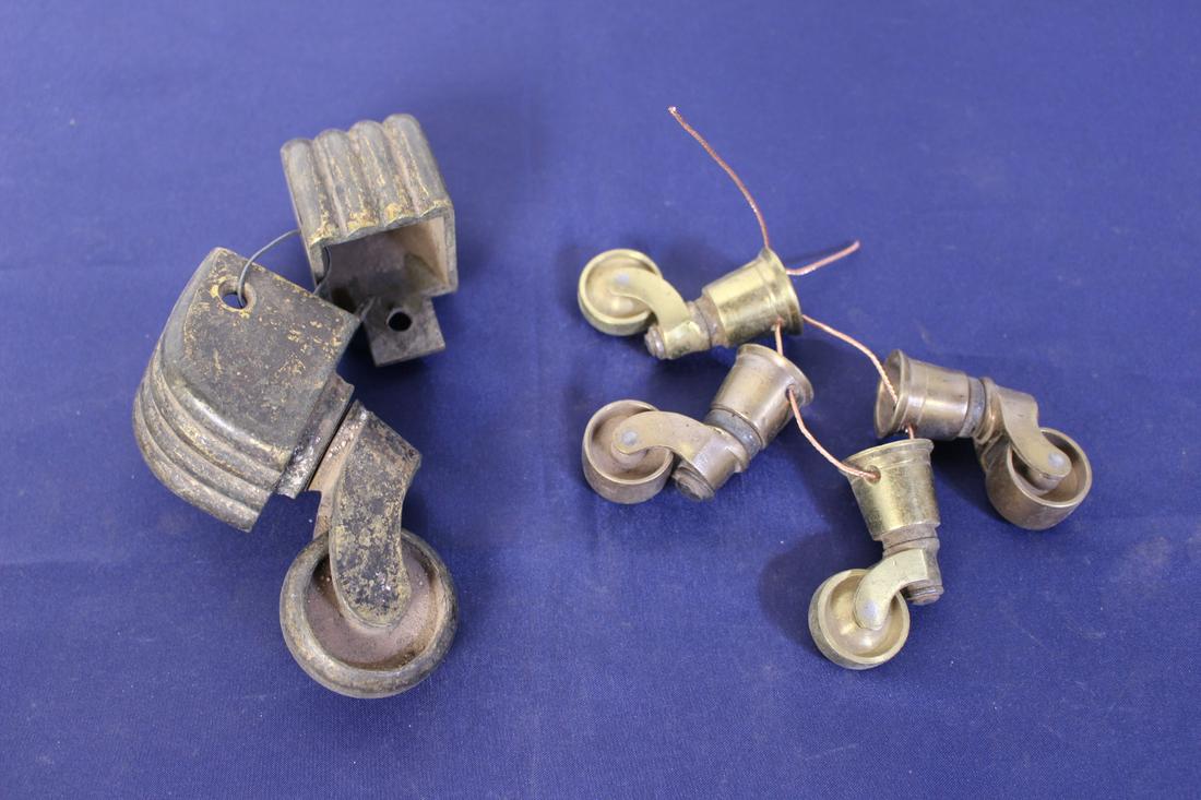 2 Set of Antique Brass Casters: 2 Set of antique brass casters, one measures 4"L x 3.5"H, one measures 1.5"L x 2"H