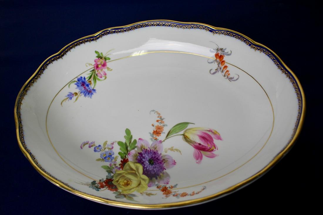 Antique Meissen Porcelain Bowl: Antique Meissen porcelain bowl with flower and gold rim in excellent condition. Based on the mark, it is believed to be from 1934. Marked and numbered. Measures 12.5"W x 9.25"Depth