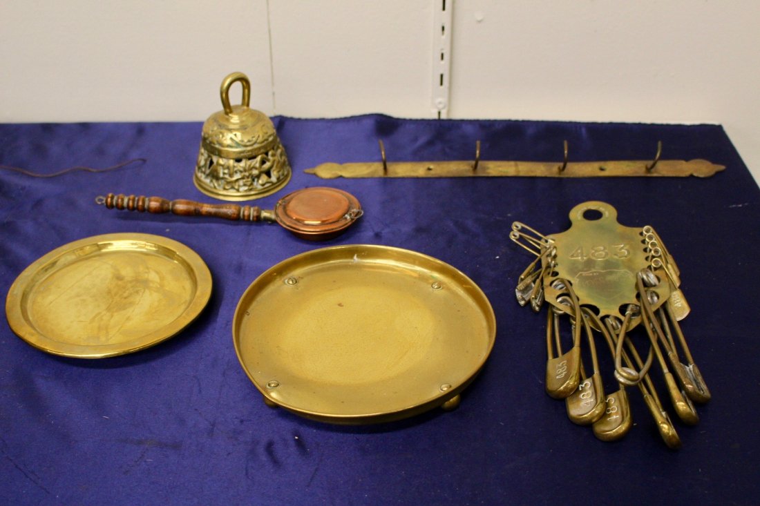 Assortment of Brass Pieces: Assortment of 6 brass pieces. Including 19th Century bell, 2 trivets, a hanging rack etc. Varied dimensions.