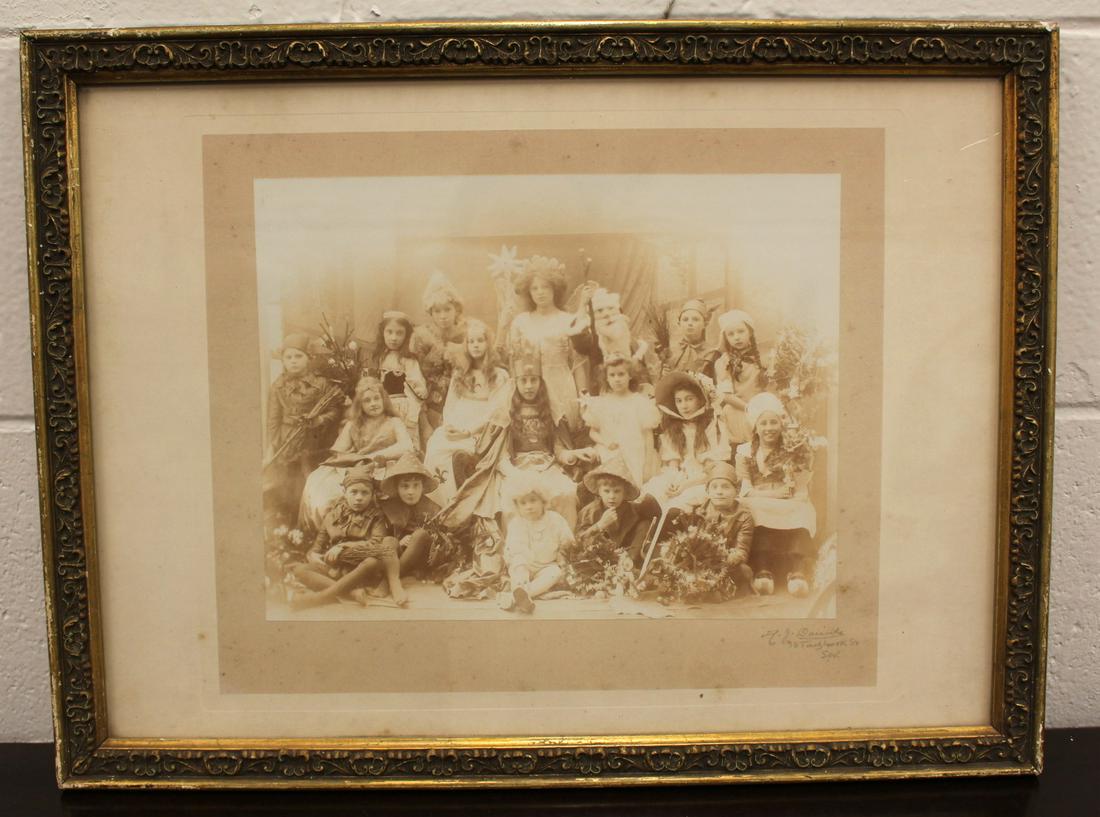 Antique Edwardian Photograph of Children's Christmas Fete: Antique Edwardian photograph of children's christmas fete. Acquired by consigner at London market. Signed. Signature unidentified. Photo measures 11 1/2" x 9". Frame measures 20" x 15".