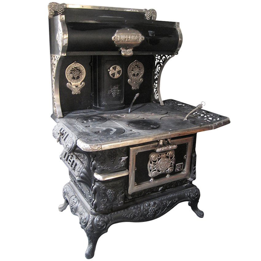 Royal Superior Wood Stove: Circa 1900, Cast iron wood burning Victoria-style stove with all original parts. Oven re-lined Measurements: 5'2"H X 48"W X 30"D