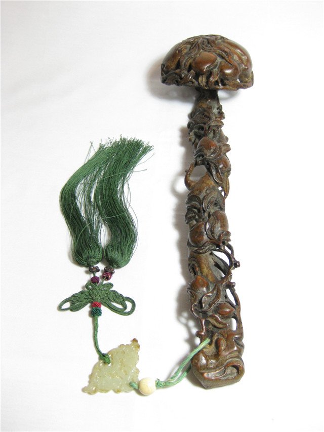A carved bamboo Ruyi scepter: A carved bamboo Ruyi scepter with carved jade, 18th century. L 13"