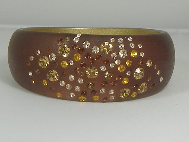 Vintage Crystal Autumn Sunset Lucite Bangle Bracelet: For auction, a vintage autumn sunset swarovski crystal lucite bangle. This bangle features an array of varying size and colored crystals that is sure to amaze. Bracelet measures approx. 2 3/4 inches a