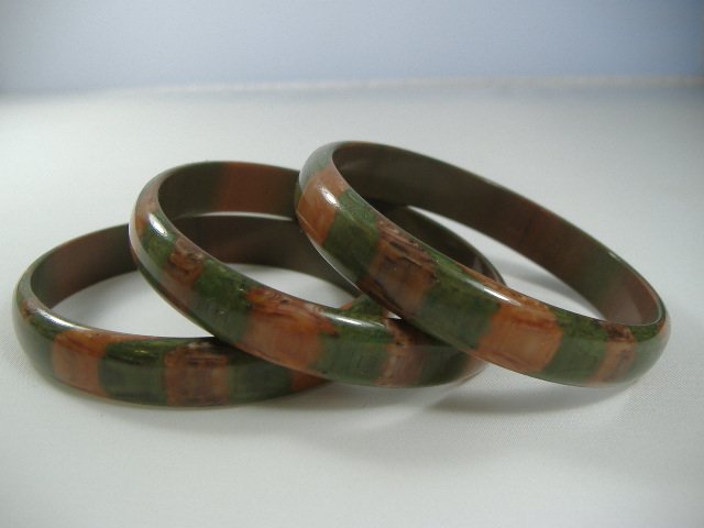 3 Vintage Lucite 1970's Rain Forest Bangle Bracelets: Manufactured by Best Plastics of Providence RI in the 1970's. Each Measures approx. 1/2 inch in width and approx. 2 3/4 inches in diameter.