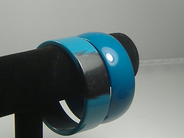 2 Vintage Lucite 1970s Aqua Bangle Bracelets: Manufactured by Best Plastics of Providence RI in the 1970s. Original factory stock. Each bracelet measures approx. 1 inch in width and approx. 2 3/4 at their maximum diameter.