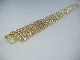 Ann Primrose Crystalleria Designer Tennis Bracelet: From the Ann Primrose Collection comes this opportunity to own a masterpiece! Chunky, Attention grabbing, and sleek, this bangle will be the talk of any gathering! The angular crystals glare as light 