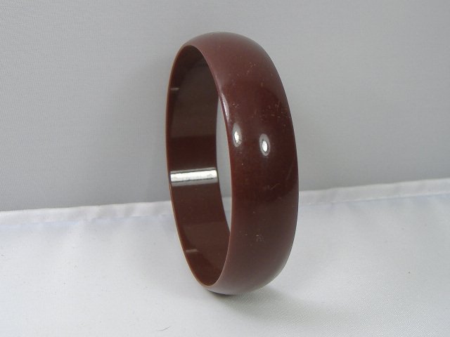 Vintage Lucite Bangle Bracelet: Vintage Lucite Bangle Bracelet. Manufactured by Best Plastics of Providence RI in the 1970s. Measures approx. 2 3/4 inches at it's maximum width