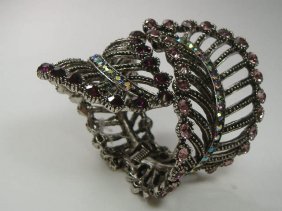 Ann Primrose Crystalleria Designer Bangle Bracelet: From the Ann Primrose Collection comes this opportunity to own a masterpiece! Chunky, Attention grabbing, and sleek, this bangle will be the talk of any gathering! The angular crystals glare as light 