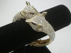 Ann Primrose Crystalleria Designer Bangle Bracelet: From the Ann Primrose Collection comes this opportunity to own a masterpiece! Chunky, Attention grabbing, and sleek, this bangle will be the talk of any gathering! The angular crystals glare as light 