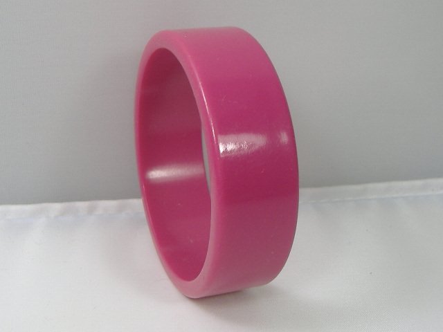 Vintage Lucite Bangle Bracelet: Vintage Lucite Bangle Bracelet. Manufactured by Best Plastics of Providence RI in the 1970s. Measures approx. 2 3/4 inches at it's maximum width