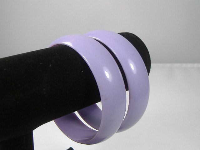 Set of 2 Vintage Lucite Bangle Bracelets: 2 Vintage Lucite Bangle Bracelets. Manufactured by Best Plastics of Providence RI in the 1970s. Measures approx. 2 3/4 inches at their maximum width