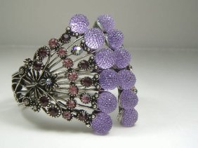 Ann Primrose Crystalleria Designer Bangle Bracelet: From the Ann Primrose Collection comes this opportunity to own a masterpiece! Chunky, Attention grabbing, and sleek, this bangle will be the talk of any gathering! The angular crystals glare as light 