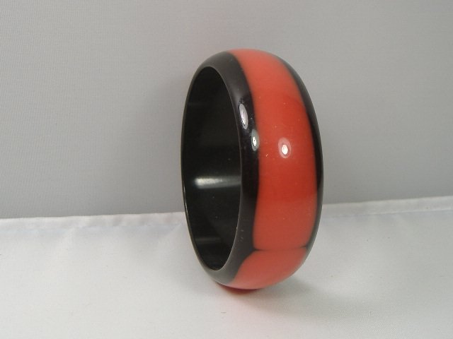 Vintage Lucite Bangle Bracelet: Vintage Lucite Bangle Bracelet. Manufactured by Best Plastics of Providence RI in the 1970s. Measures approx. 2 3/4 inches at it's maximum width