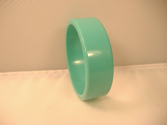 Vintage Lucite Bangle Bracelet: Vintage Lucite Bangle Bracelet. Manufactured by Best Plastics of Providence RI in the 1970s. Measures approx. 2 3/4 inches at it's maximum width
