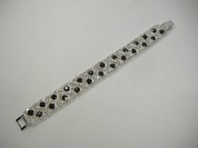 Ann Primrose Crystalleria Designer Tennis Bracelet: From the Ann Primrose Collection comes this opportunity to own a masterpiece! Chunky, Attention grabbing, and sleek, this bangle will be the talk of any gathering! The angular crystals glare as light 