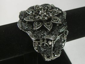 Ann Primrose Crystalleria Designer Bangle Bracelet: From the Ann Primrose Collection comes this opportunity to own a masterpiece! Chunky, Attention grabbing, and sleek, this bangle will be the talk of any gathering! The angular crystals glare as light 
