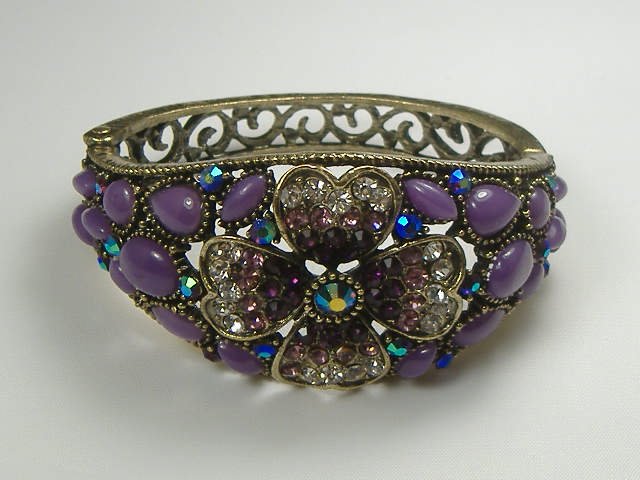 Ann Primrose Crystalleria Designer Bangle Bracelet: From the Ann Primrose Collection comes this opportunity to own a masterpiece! Chunky, Attention grabbing, and sleek, this bangle will be the talk of any gathering! The angular crystals glare as light 