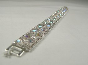 Ann Primrose Crystalleria Designer Tennis Bracelet: From the Ann Primrose Collection comes this opportunity to own a masterpiece! Chunky, Attention grabbing, and sleek, this bangle will be the talk of any gathering! The angular crystals glare as light 