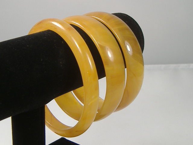 Set of 3 Vintage Lucite Bangle Bracelets: 3 Vintage Lucite Bangle Bracelets. Manufactured by Best Plastics of Providence RI in the 1970s. Measures approx. 2 3/4 inches at their maximum width
