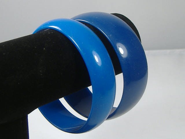 Set of 2 Vintage Lucite Bangle Bracelets: 2 Vintage Lucite Bangle Bracelets. Manufactured by Best Plastics of Providence RI in the 1970s. Measures approx. 2 3/4 inches at their maximum width