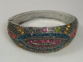 Ann Primrose Crystalleria Designer Bangle Bracelet: From the Ann Primrose Collection comes this opportunity to own a masterpiece! Chunky, Attention grabbing, and sleek, this bangle will be the talk of any gathering! The angular crystals glare as light 