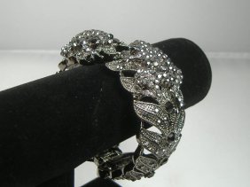 Ann Primrose Crystalleria Designer Bangle Bracelet: From the Ann Primrose Collection comes this opportunity to own a masterpiece! Chunky, Attention grabbing, and sleek, this bangle will be the talk of any gathering! The angular crystals glare as light 