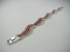Ann Primrose Crystalleria Designer Tennis Bracelet: From the Ann Primrose Collection comes this opportunity to own a masterpiece! Chunky, Attention grabbing, and sleek, this bangle will be the talk of any gathering! The angular crystals glare as light 