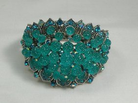 Ann Primrose Crystalleria Designer Bangle Bracelet: From the Ann Primrose Collection comes this opportunity to own a masterpiece! Chunky, Attention grabbing, and sleek, this bangle will be the talk of any gathering! The angular crystals glare as light 
