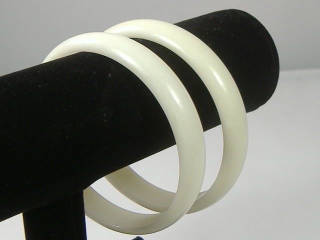 Set of 2 Vintage Lucite Bangle Bracelets: 2 Vintage Lucite Bangle Bracelets. Manufactured by Best Plastics of Providence RI in the 1970s. Measures approx. 2 3/4 inches at their maximum width